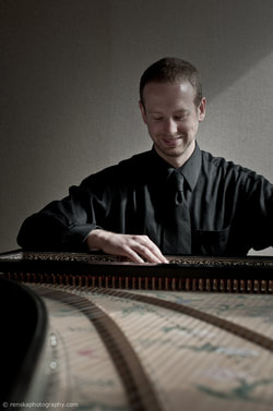 Michael Peterson playing harpsichord